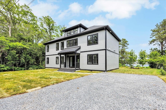 2 Buttercup Ln, South Yarmouth, MA 02664 - view of front of home with a front lawn and a standing seam roof