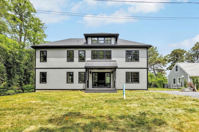 2 Buttercup Ln, South Yarmouth, MA 02664 - view of front of home featuring a front yard and a standing seam roof