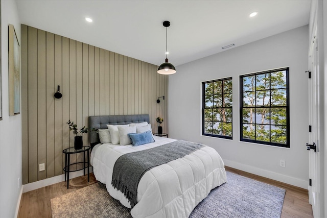 2 Buttercup Ln, South Yarmouth, MA 02664 - bedroom featuring wood finished floors, recessed lighting, and wooden walls