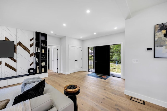 2 Buttercup Ln, South Yarmouth, MA 02664 - living room featuring light wood-type flooring, recessed lighting, and stairway
