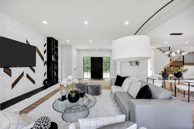 2 Buttercup Ln, South Yarmouth, MA 02664 - living area featuring stairway, recessed lighting, wood finished floors, and a chandelier