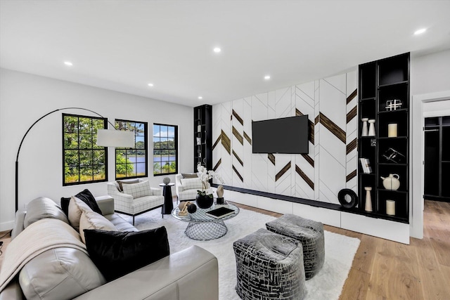 2 Buttercup Ln, South Yarmouth, MA 02664 - living room featuring an accent wall, recessed lighting, and light wood-style floors