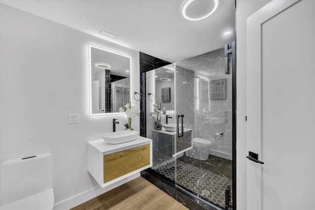 2 Buttercup Ln, South Yarmouth, MA 02664 - full bathroom featuring vanity, a marble finish shower, and wood finished floors