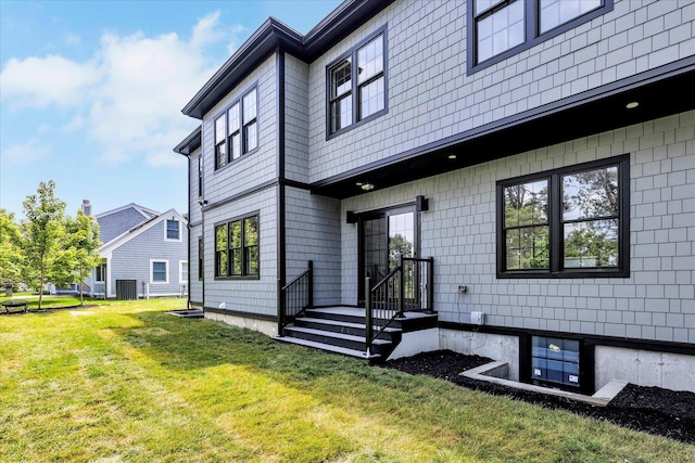 2 Buttercup Ln, South Yarmouth, MA 02664 - rear view of house featuring a yard