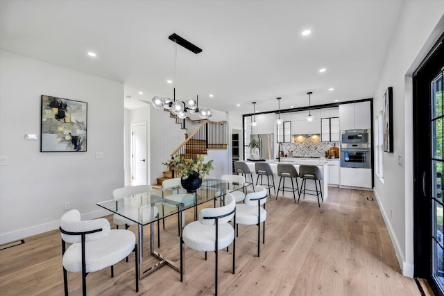 2 Buttercup Ln, South Yarmouth, MA 02664 - dining area featuring recessed lighting, stairs, light wood finished floors, and a chandelier
