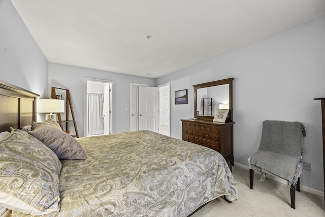 carpeted bedroom with baseboards