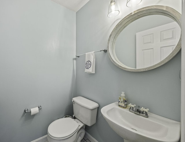 bathroom featuring sink and toilet