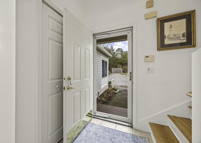 doorway to outside featuring light tile patterned floors