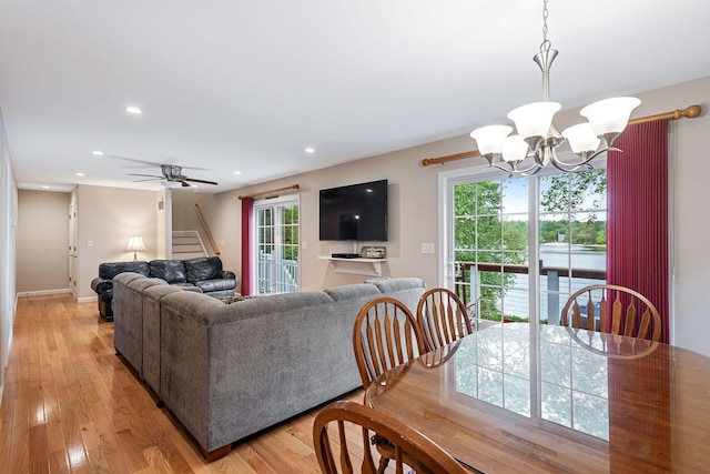 living area with stairway, recessed lighting, light wood finished floors, and plenty of natural light