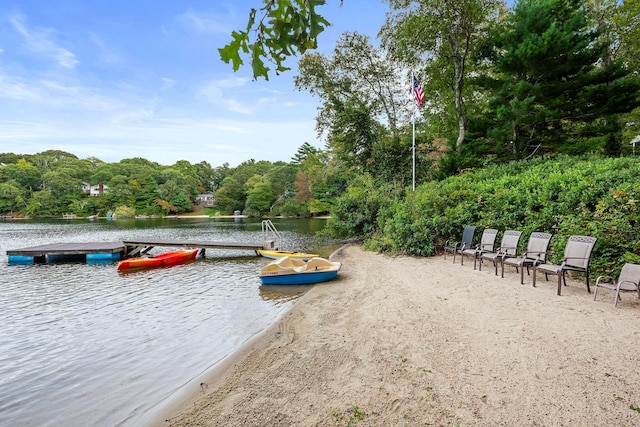 exterior space featuring a floating dock and a water view