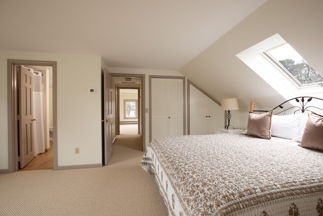 72 Lookout Rd, Yarmouth Port, MA 02675 - bedroom with a skylight, light carpet, lofted ceiling, and multiple closets