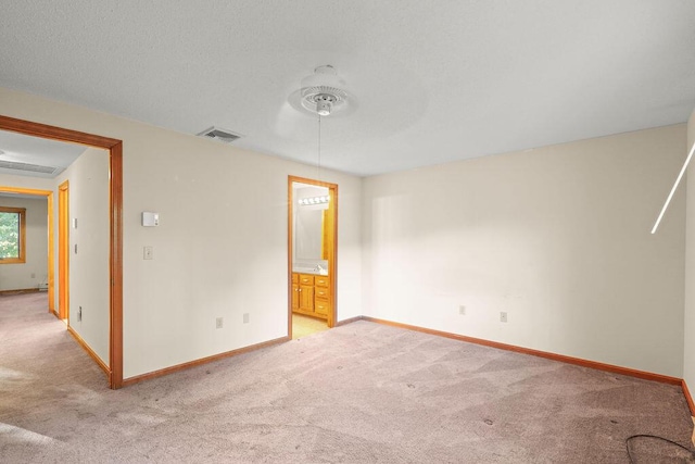 empty room featuring light colored carpet