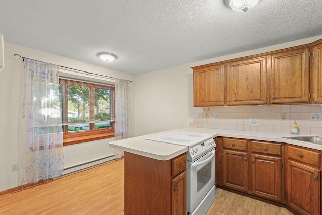 kitchen featuring tasteful backsplash, white electric range, baseboard heating, light wood-type flooring, and kitchen peninsula