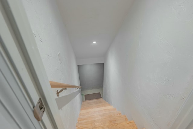 staircase with wood finished floors