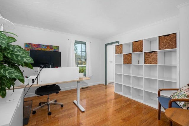 home office featuring ornamental molding and wood finished floors