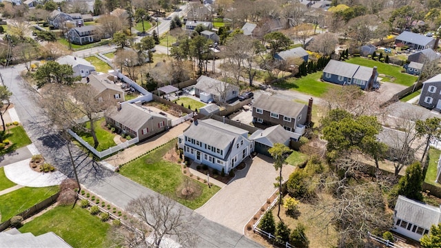 aerial view of property and surrounding area featuring nearby suburban area
