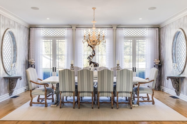 dining room featuring french doors, wood-type flooring, and plenty of natural light