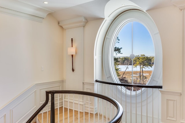 stairs featuring lofted ceiling and hardwood / wood-style flooring