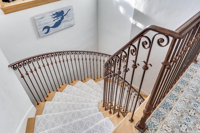 staircase featuring hardwood / wood-style flooring