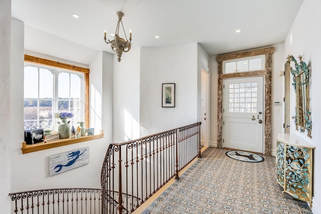 entryway featuring a notable chandelier