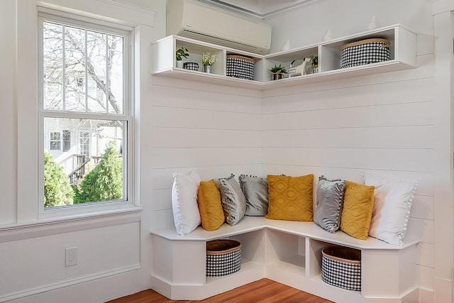 mudroom featuring a wall mounted air conditioner