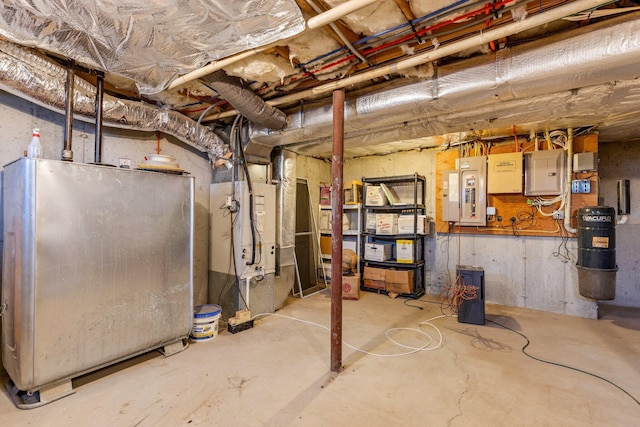 basement featuring heating unit and electric panel