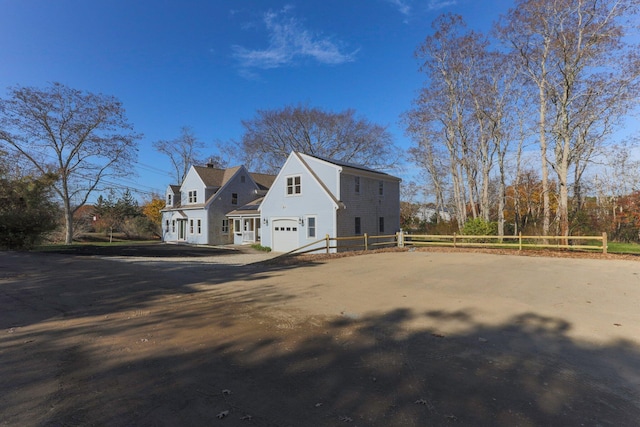 view of side of property featuring a garage