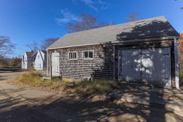 view of side of property featuring a garage