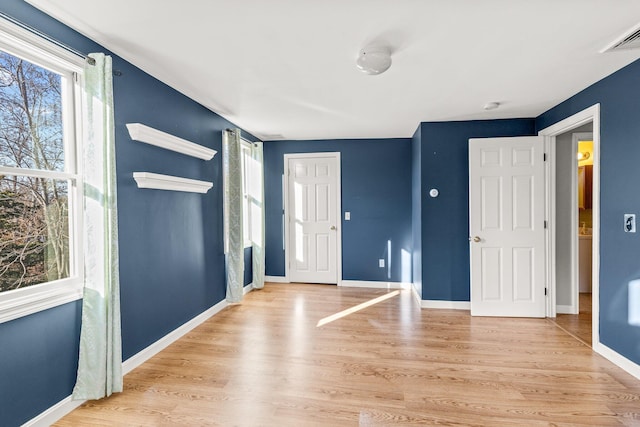 entrance foyer featuring a healthy amount of sunlight and light wood-type flooring