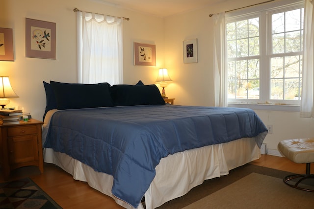 bedroom with wood finished floors