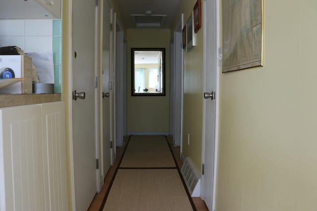 hallway featuring visible vents