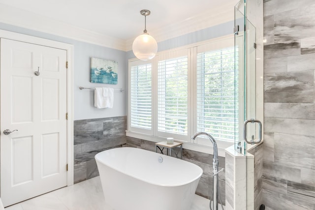 335 Falmouth Woods Rd, East Falmouth, MA 02536 - full bathroom featuring tile walls, a soaking tub, a shower stall, crown molding, and wainscoting