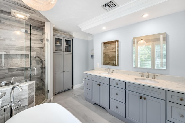 335 Falmouth Woods Rd, East Falmouth, MA 02536 - full bathroom featuring a freestanding tub, marble look tile flooring, a shower stall, double vanity, and recessed lighting