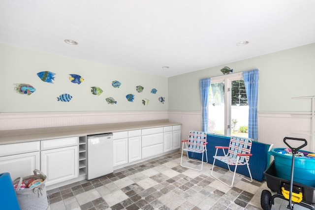 335 Falmouth Woods Rd, East Falmouth, MA 02536 - rec room with wainscoting, light stone finish floors, and recessed lighting