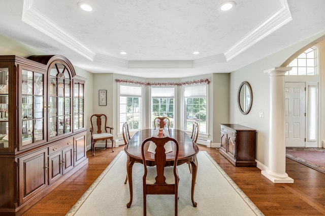 335 Falmouth Woods Rd, East Falmouth, MA 02536 - dining space featuring a raised ceiling, decorative columns, ornamental molding, wood finished floors, and recessed lighting