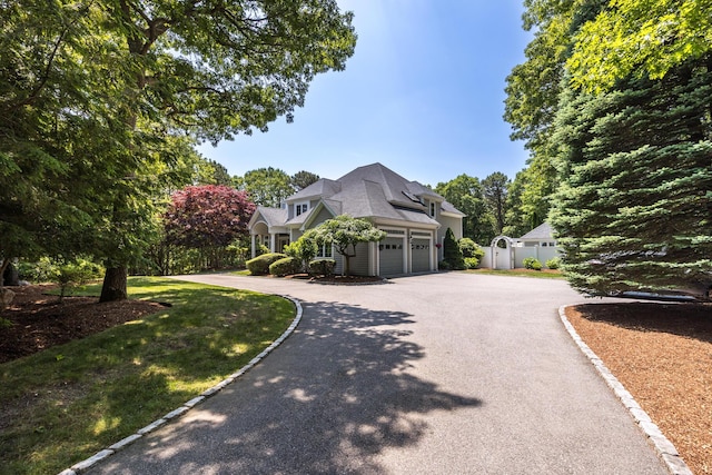 335 Falmouth Woods Rd, East Falmouth, MA 02536 - view of front of house with a garage and asphalt driveway