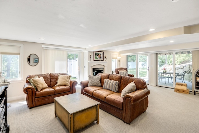 335 Falmouth Woods Rd, East Falmouth, MA 02536 - living room with a fireplace, light colored carpet, plenty of natural light, and recessed lighting