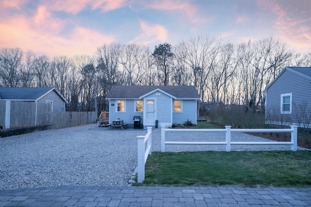 view of front facade with a fenced front yard and a front yard