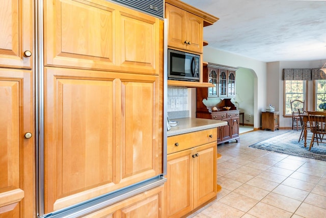 30 Monomessat Way, Chatham, MA 02633 - kitchen with black microwave, arched walkways, light tile patterned floors, and light countertops