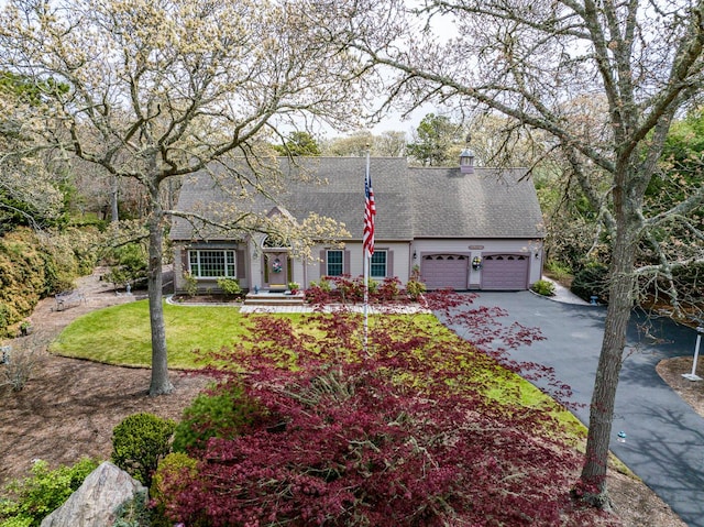 30 Monomessat Way, Chatham, MA 02633 - view of front of home with driveway, a shingled roof, and a garage