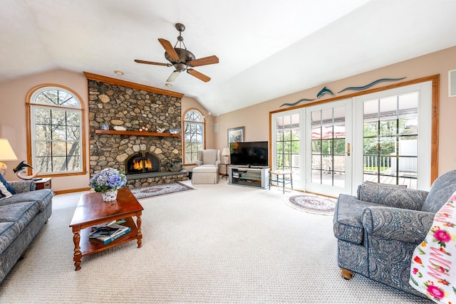 30 Monomessat Way, Chatham, MA 02633 - carpeted living area with vaulted ceiling, ceiling fan, plenty of natural light, and a stone fireplace