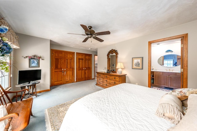 30 Monomessat Way, Chatham, MA 02633 - carpeted bedroom featuring multiple closets, ensuite bath, a ceiling fan, baseboards, and a sink