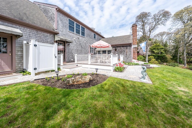 30 Monomessat Way, Chatham, MA 02633 - view of grassy yard with a wooden deck