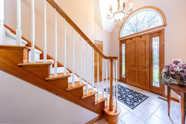 30 Monomessat Way, Chatham, MA 02633 - entryway with stairway, a chandelier, tile patterned floors, and a towering ceiling