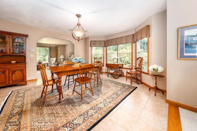 30 Monomessat Way, Chatham, MA 02633 - dining area featuring arched walkways, baseboards, and light tile patterned floors