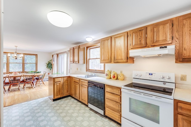 79 Pinewood Cir, Wellfleet, MA 02667 - kitchen with light countertops, a sink, white electric range oven, under cabinet range hood, and black dishwasher