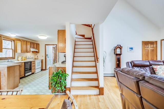 79 Pinewood Cir, Wellfleet, MA 02667 - interior space with baseboard heating, wood finished floors, and washer / dryer
