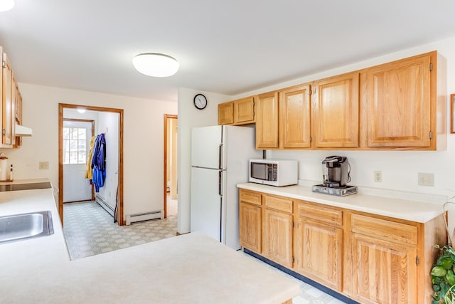 79 Pinewood Cir, Wellfleet, MA 02667 - kitchen with light countertops, baseboard heating, light brown cabinetry, and white appliances
