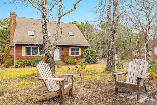 79 Pinewood Cir, Wellfleet, MA 02667 - rear view of property featuring a lawn, a chimney, and a shingled roof
