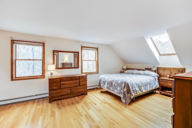79 Pinewood Cir, Wellfleet, MA 02667 - bedroom featuring a baseboard radiator, light wood-style flooring, and lofted ceiling with skylight